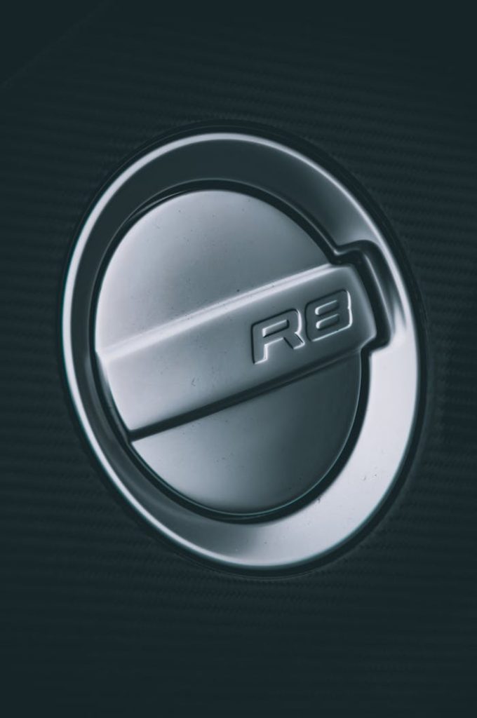 Detailed shot of the R8 fuel cap on a high-performance sports vehicle.